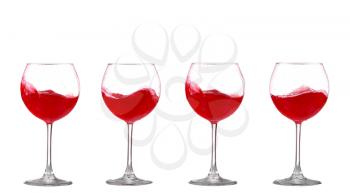 red wine splashing in a glass, isolated on white