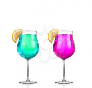 Set of beautiful shot glasses filled with colored alcoholic cocktails