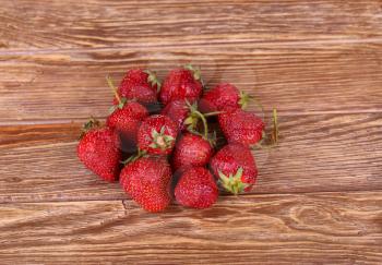 Ripe strawberries, isolated on wooden background. Top View