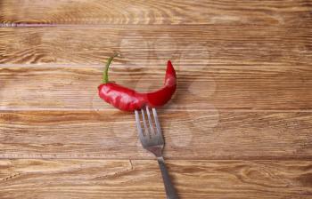 Chilli peppers and wood texture , background.