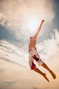 male beach volleyball game player jump on hot sand