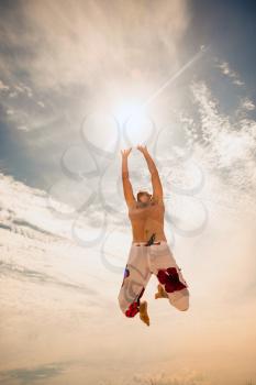 male beach volleyball game player jump on hot sand