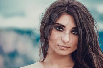 Portrait of beautiful young lady. Outdoors. Smoky eyes. 