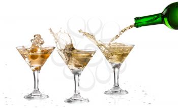 A martini glass on a white background; alcohol cocktail set with splash isolated on white; horizontal format