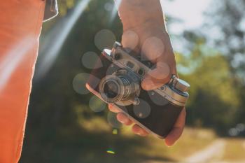 Vintage camera on grass background