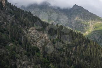 darkly rocks and clouds. Caucasus, Dombai, Karachay-Cherkessia
