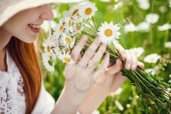 Young red-haired traveler in fairy-tale beautiful scenery. The idea and concept of rest, relaxation, freedom