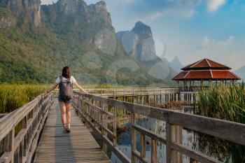 Young woman relaxing in park. Sam Roi Yod National Park, Thailand