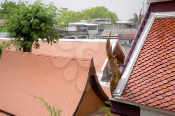 Top part of traditional Thai style building. Temple roof in Thai style Is a style that is unique according to Buddhist principles Which will have a serpent head which is an animal in Thai literature
