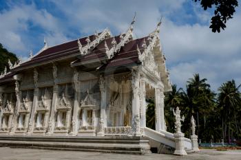 a beautiful little white Thai temple in Krabi province, by the sea. Vacation and travel concept.