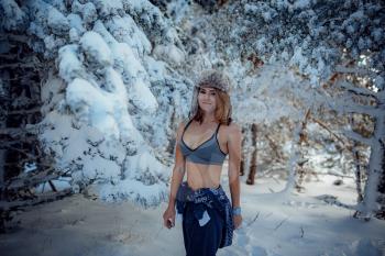 sexy girl in the winter forest in underwear, woman in snow. idea and concept of a strong and seasoned woman, Russian woman