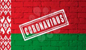 Flag of the Belarus with original proportions. stamped of Coronavirus. brick wall texture. Corona virus concept. On the verge of a COVID-19 or 2019-nCoV Pandemic.