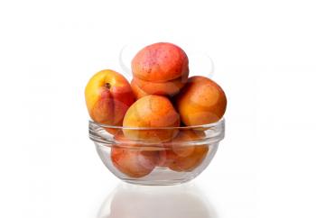 glass bowl with apricots on a white background. idea and concept of healthy and proper nutrition, organic products