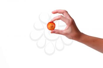 woman holds plum in hands on an isolated white background. idea and concept of healthy eating