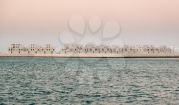 Construction of new apartment buildings on reclaimed land near the Royal Palace in Northern City, Bahrain