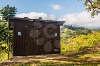 Wooden restroom or toilet building in remote forest in Kauai forest