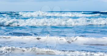 Stormy seas coming to the beach in parallel rows off Polihale Beach, Kauai, Hawaii