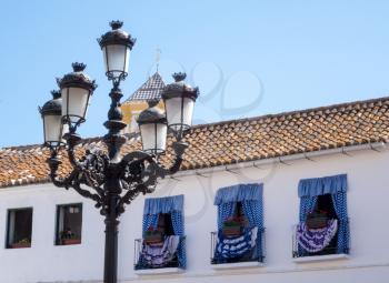 Windows decorated in spanish dancing theme in Plaza de los Naranjos in Marbella, Andalucia, Spain
