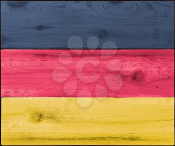 Timber planks of wood that have been painted or stained in the colors of a flag as a background for Germany