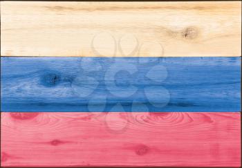 Timber planks of wood that have been painted or stained in the colors of a flag of Russia as a background