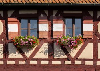 Flowers on half timbered windows on the Kaiserburg castle in Nuremberg, Germany