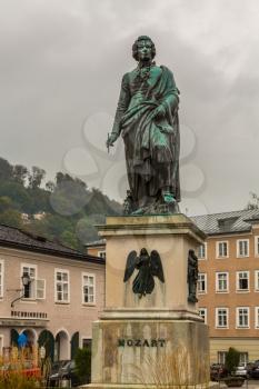 Statue of Mozart on cloudy rainy day in Salzburg Austria