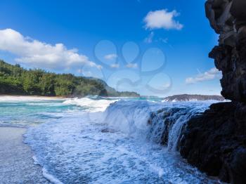 Dramatic powerful waves crash over rocks on dangerous beach at Lumaha'i, Kauai, Hawaii