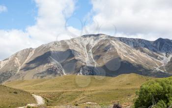 View from the train windows of TranzAlpine railway that climbs the Southern Alps in New Zealand towards Arthurs Pass