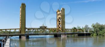 Yellow drawbridge known as Tower Bridge Gateway across Sacramento river in Capital of California