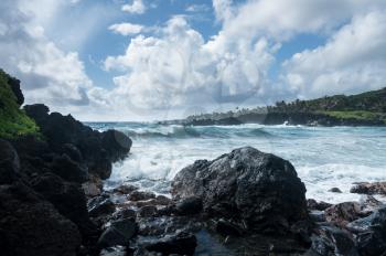 Black sand beach at Waianapanapa State Park on the road to Hana in Maui, Hawaii