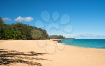 Golden sands with warm turquoise ocean off Lumahai Beach in Kauai in Hawaiian islands