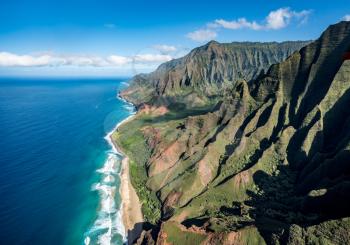 Aerial view of Na Pali coastline and Kalalau beach on hawaiian island of Kauai from helicopter flight