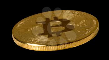 Isolated macro image of a single bitcoin or bitcoin against black background