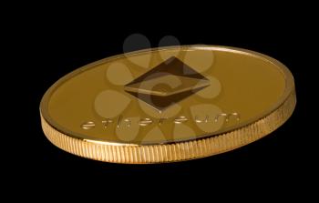 Isolated macro image of a single ether or ethereum coin against black background