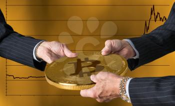 Hands of three financial traders gripping bitcoin against a background of rising prices for the currency