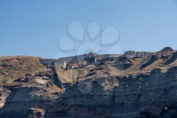 Castle and walls on cliffside and the mountaintop of Santorini