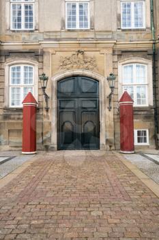 Doorway to the Amalienborg palace in the city of Copenhagen in Denmark