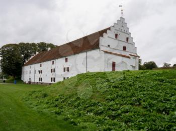 White exterior of Aalborghus Castle in the old town of Aalborg in Denmark