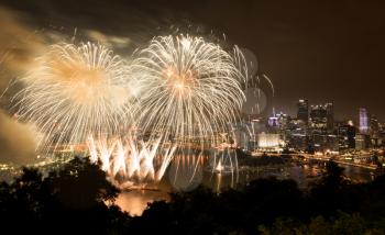 PITTSBURGH, PA - JULY 4, 2018: Fireworks from the river in front of downtown Pittsburgh on Independence Day.