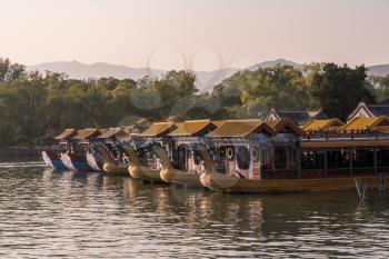 Tour boats on lake at the Emperor Summer Palace in Beijing, China