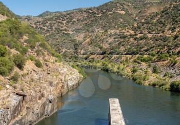 Solid structure of the Valeira dam on River Douro looking down into the gorge and narrow canyon