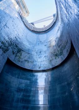 View towards the sky inside the very deep lock of the Barragem do Carrapatelo on Douro River in Portugal