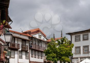 Carved balconies on traditional houses overlooking the main square in Guimaraes