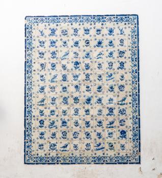 Rectangular pattern of ceramic wall tiles or Azulejo with birds and plants from Portugal