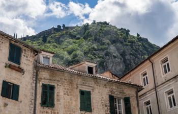 Green shutters on house in streets of old town Kotor in Montenegro