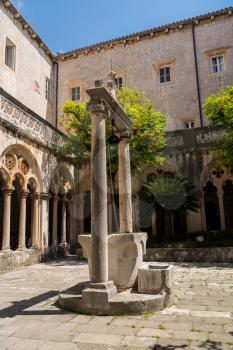 Well and cloisters of Franciscan Monastery in the old town of Dubrovnik in Croatia
