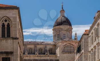 Statues and dome on cathedral church in the old town of Dubrovnik in Croatia