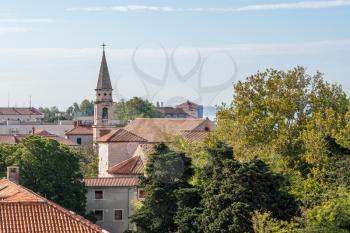 Ancient buildings and tower in the old town by the port of Zadar in Croatia