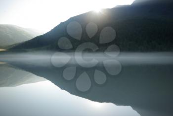 Beautiful mountain landscape near the lake. Mountain Lake. Kind of mountainous terrain and the water in the valley.