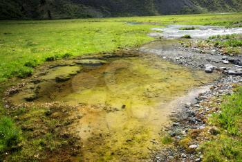 Mountain landscape. Highlands, the mountain peaks, gorges and valleys. The stones on the slopes.